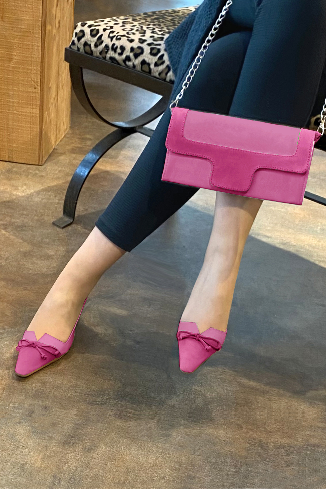Women's fuchsia pink and hot pink elegant slingback heels, with a bow on the front. Tapered toe. Medium spool heels - Worn view